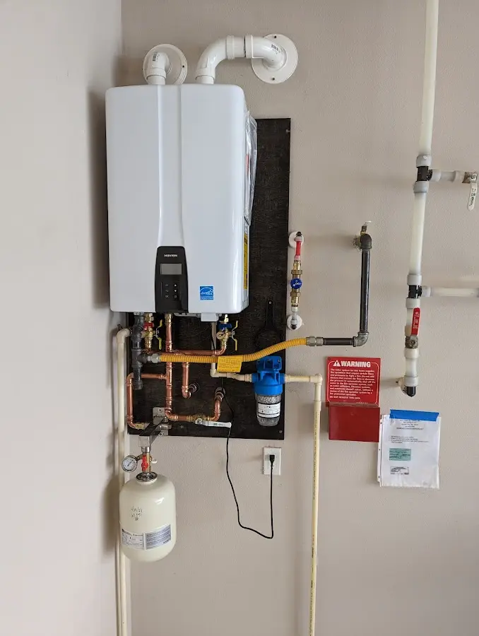 Professional plumber installing copper piping in a Union City home